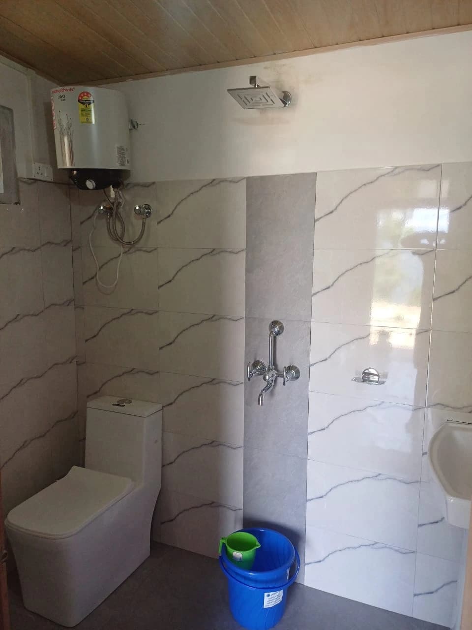 Clean attached washroom facility at Rigsel Homestay, Kalimpong