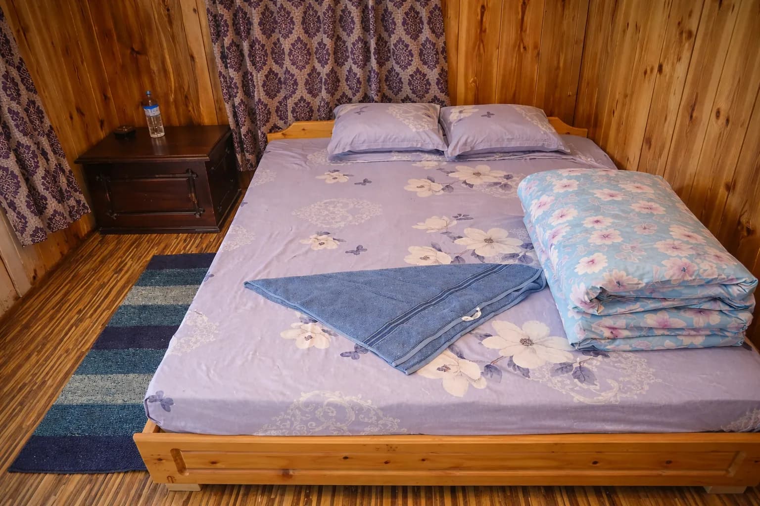 Cozy double room interior with warm decor at Rigsel Homestay