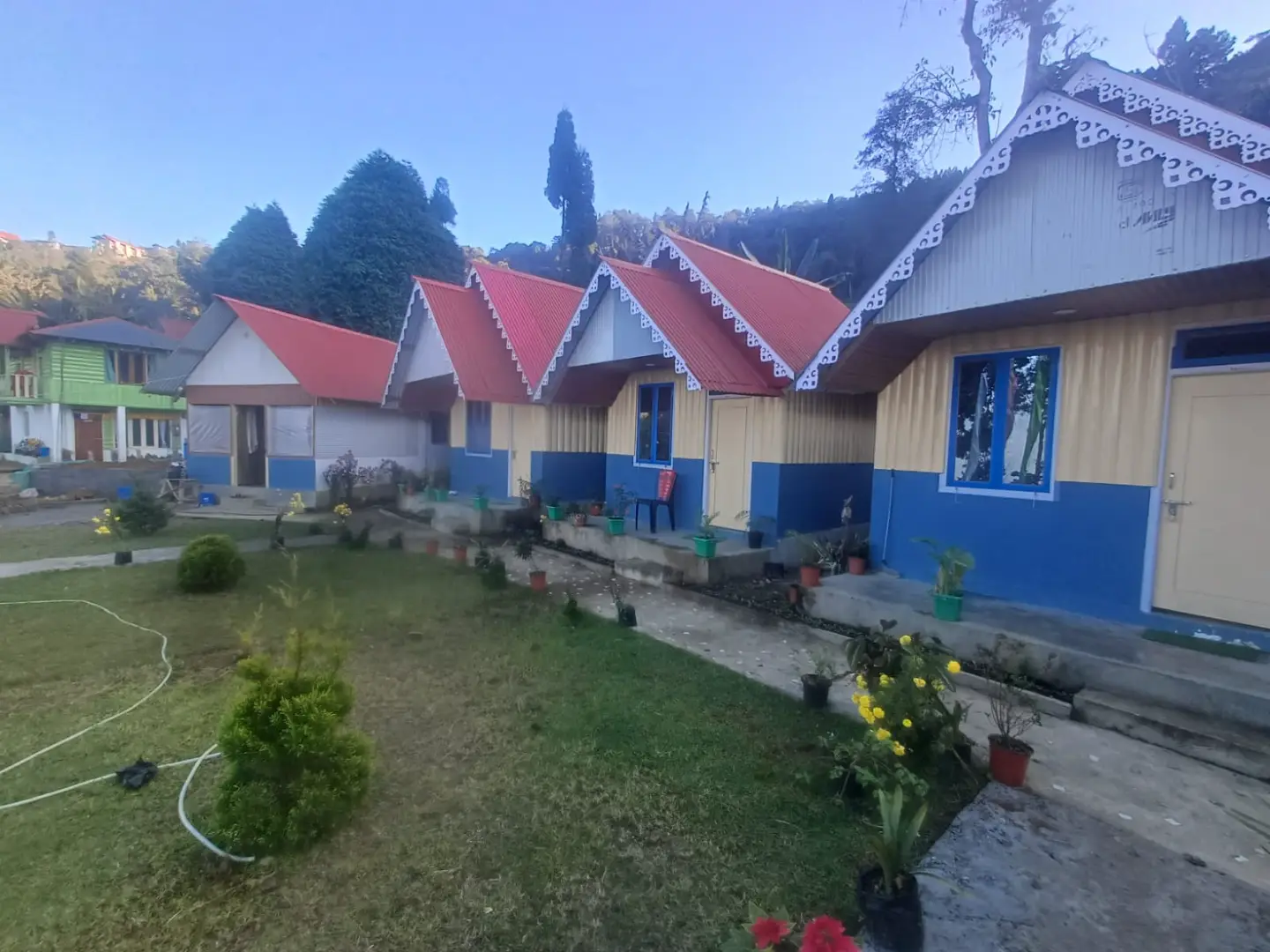 Lush green mountain landscape around Rigsel Homestay, Kaffer Gaon